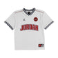 Maglietta Jordan Sport Jersey per bambini, t-shirt bianca con dettagli sportivi, logo Jordan visibile in primo piano.