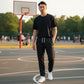 Pantaloni lunghi in cotone nero della linea Rookie Basketball, stile casual e comodo, con dettagli semplici e tessuto morbido.