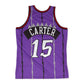 Canotta Mitchell & Ness NBA Vince Carter Raptors 1998 viola, dettaglio logo e tessuto, stile Swingman, abbigliamento sportivo.