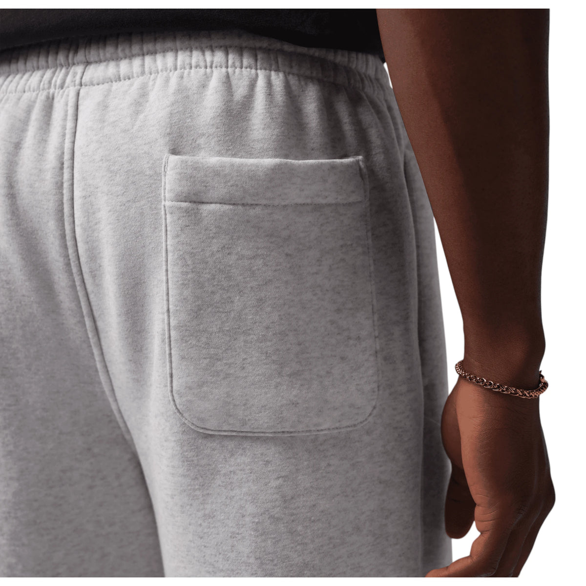 Jordan Brooklyn Fleece grigio 054 – dettaglio ricamo Jumpman Air bronzo su fleece melange