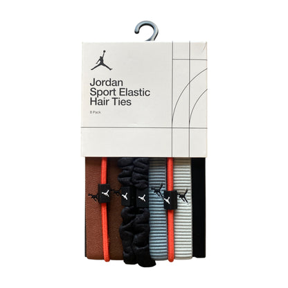 Set di 8 fasce elastiche Jordan per capelli, ideali come polsini o fascette sportive, in colore nero con logo Jordan.