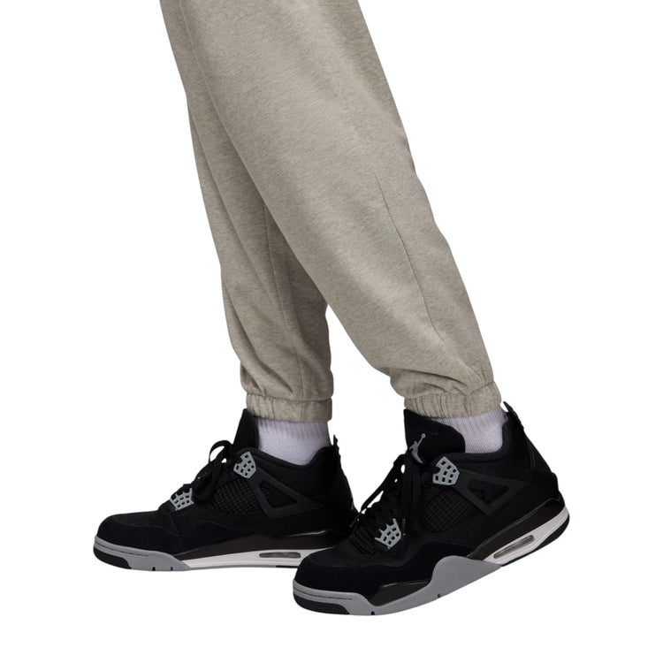 Pantaloni sportivi Jordan Air Jordan Brooklyn crossover grigi, pantaloni da uomo con design sportivo e logo Jordan.