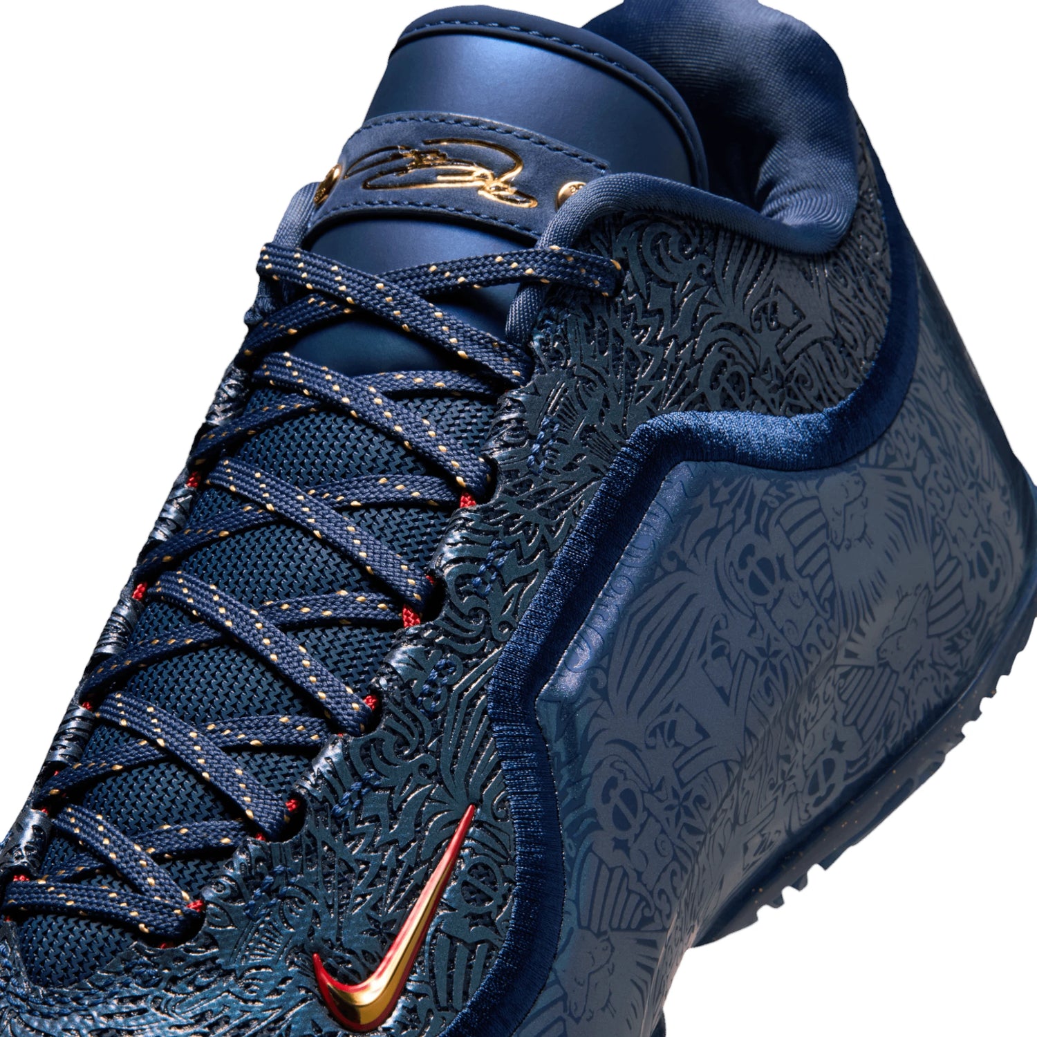 Scarpe da basket Nike LeBron XXIII "Out for Redemption" con dettagli oro e blu, firma di LeBron James, su sfondo bianco.