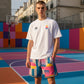T-shirt bianca PIGALLE di ROOKIE BASKETBALL, vista frontale, tessuto morbido e logo sul petto, indossata da un modello.